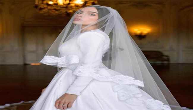 عارضة الازياء أوليفيا كولبو ملكة جمال الكون تتألق بفستان زفاف مَلَكي