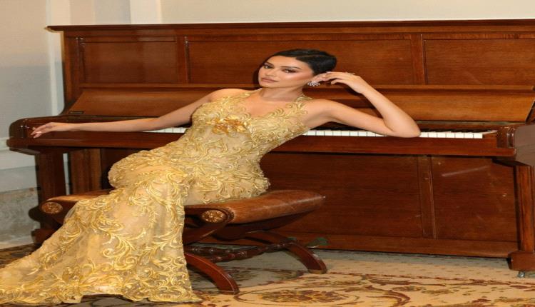 شوق الهادي تتألق بفستان ذهبي شفاف مطرز بلمسات باروكية